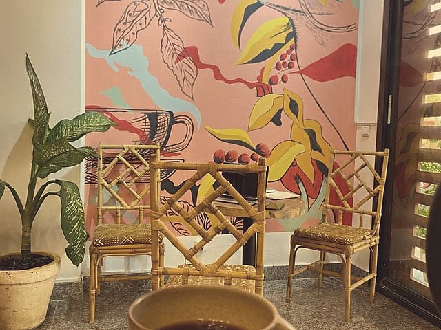 A cup of coffee on warm wooden furniture